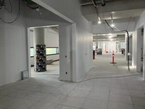 Image of a hallway in Ādisōke, under construction with new drywall installed. 