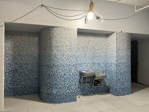  Image of the mosaic tiles leading to the bathrooms.